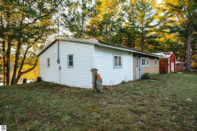 view of property exterior featuring a yard