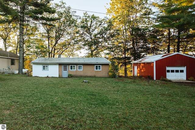 exterior space with an outbuilding and a garage