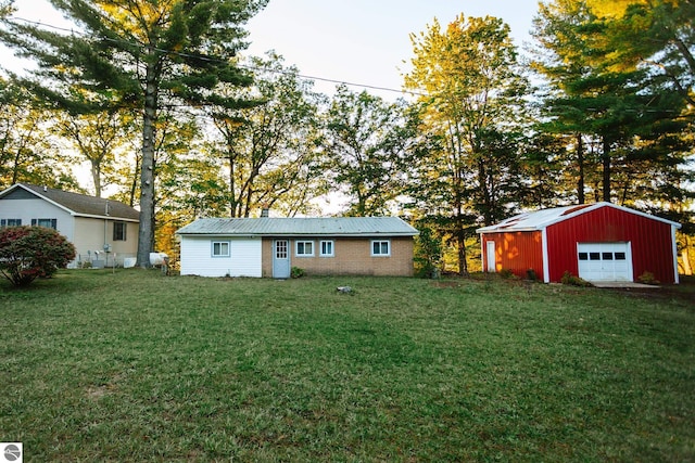 exterior space with an outbuilding and a garage