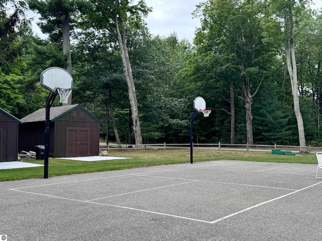 view of basketball court featuring a lawn