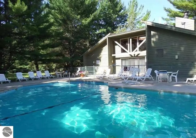 view of pool featuring a patio