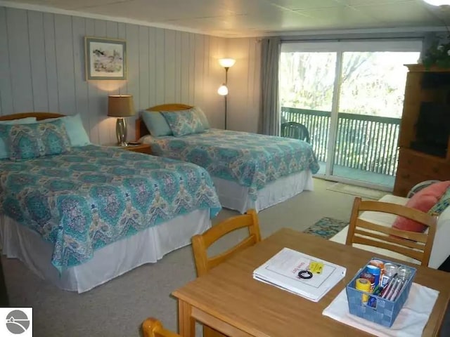 bedroom featuring carpet floors and access to exterior