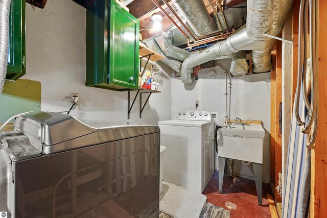 laundry room featuring hookup for a washing machine, cabinets, and sink