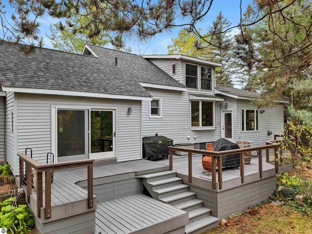 back of house with a wooden deck