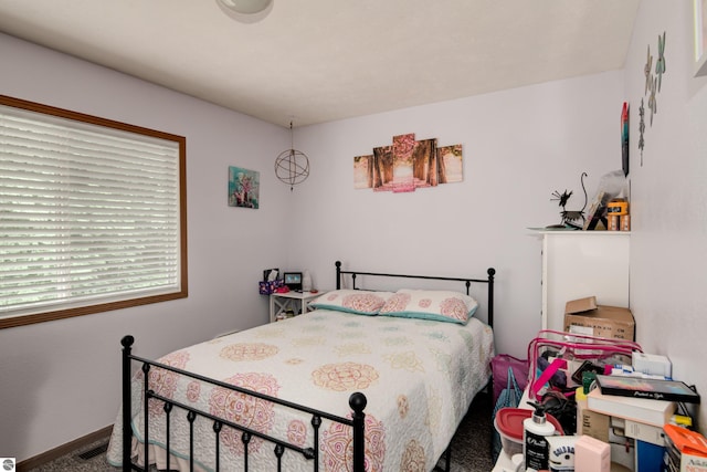 bedroom featuring carpet