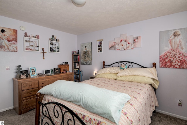 carpeted bedroom with a textured ceiling