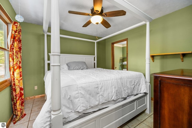 tiled bedroom with ceiling fan