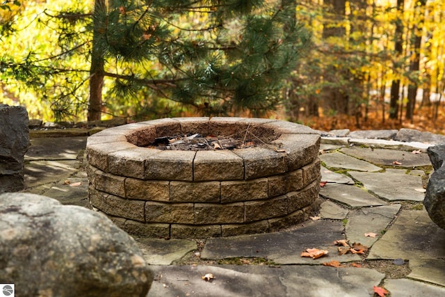 view of patio with a fire pit