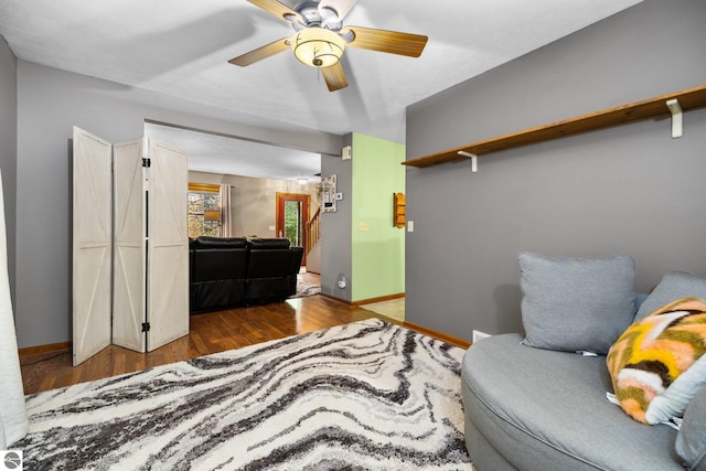 sitting room featuring hardwood / wood-style floors and ceiling fan