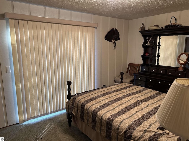 5417 Golfview Rd, Bellaire, MI 49615 - carpeted bedroom featuring a textured ceiling