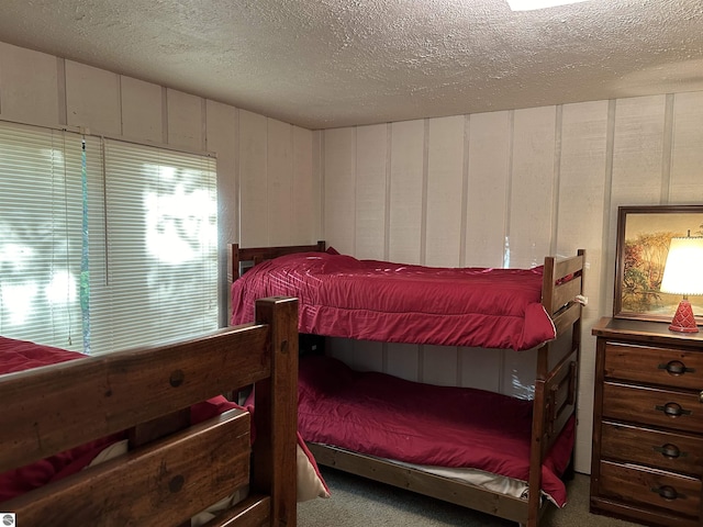 5417 Golfview Rd, Bellaire, MI 49615 - bedroom featuring a textured ceiling and carpet