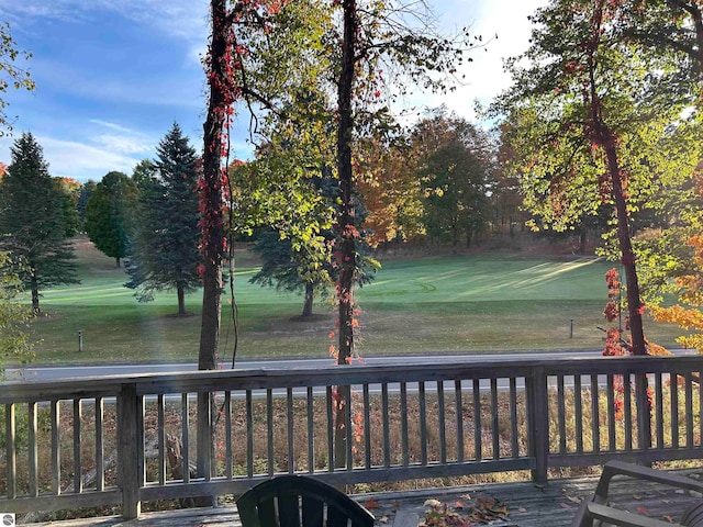 deck featuring a lawn