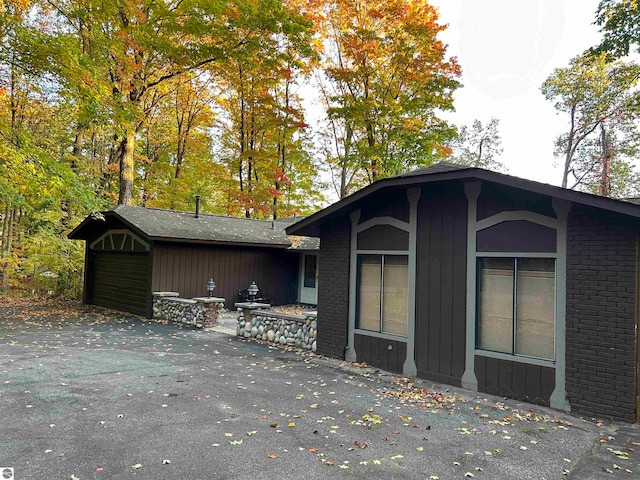 view of side of home with a garage