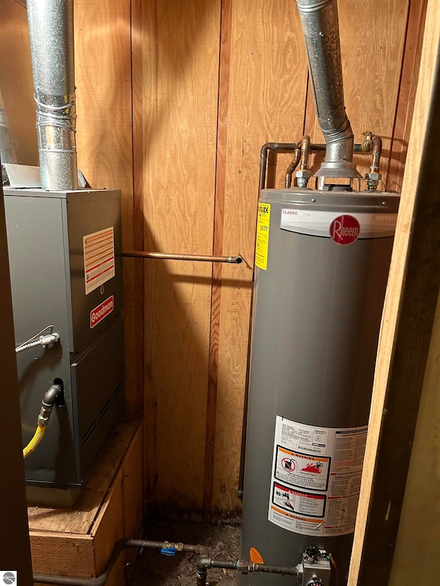 utility room with water heater