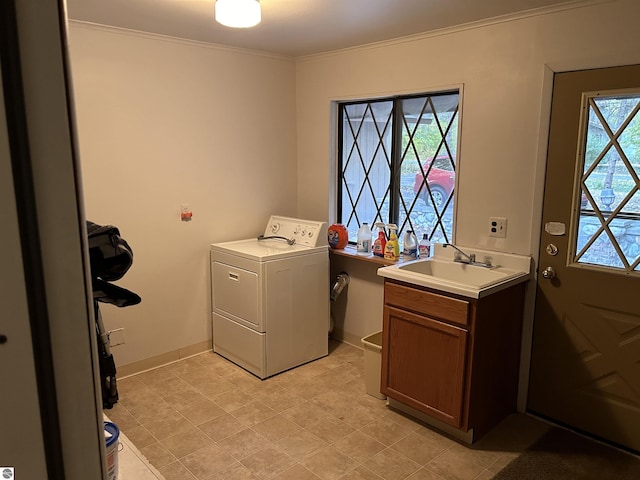 5417 Golfview Rd, Bellaire, MI 49615 - laundry room with washer / clothes dryer, ornamental molding, a sink, baseboards, and cabinet space