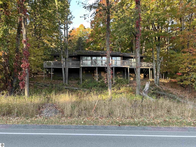 5417 Golfview Rd, Bellaire, MI 49615 - rear view of house with a wooden deck