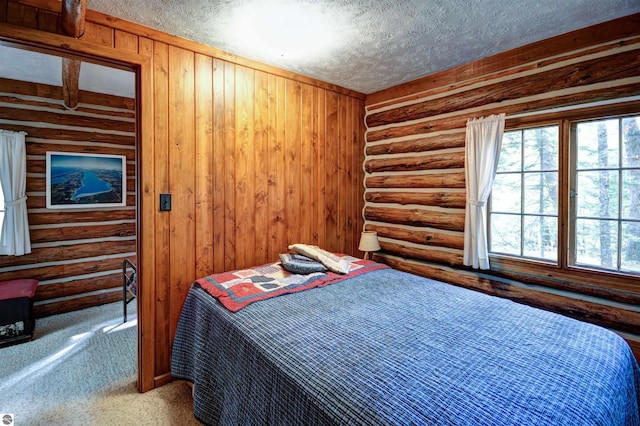 carpeted bedroom with a textured ceiling