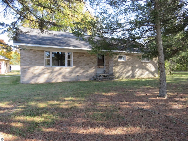 view of side of home featuring a lawn