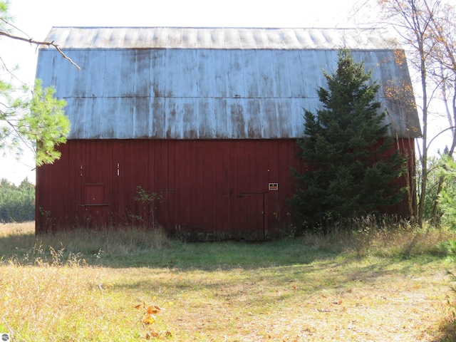 view of property exterior featuring an outbuilding