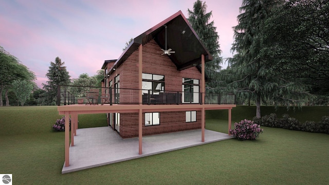 back house at dusk with a patio area and a lawn