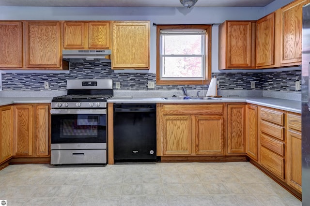 kitchen featuring dishwasher, gas range, tasteful backsplash, and sink