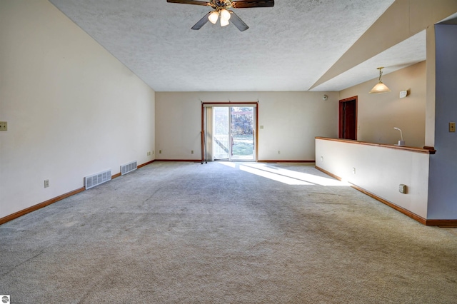 unfurnished room featuring carpet, a textured ceiling, and ceiling fan