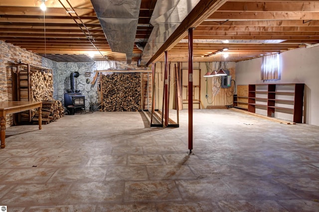 basement featuring a wood stove