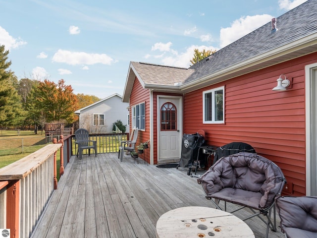 deck featuring a grill