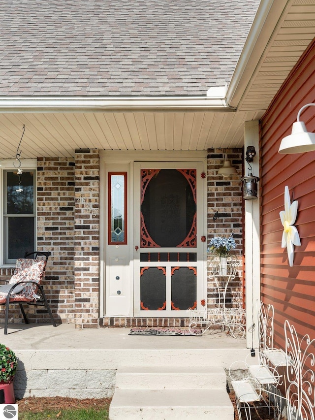 view of exterior entry with covered porch