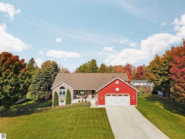 view of front of home with a front lawn and a garage