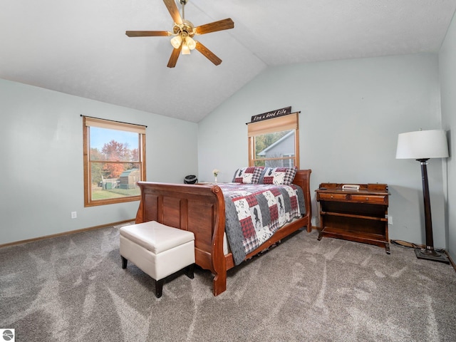 bedroom featuring vaulted ceiling, multiple windows, carpet floors, and ceiling fan