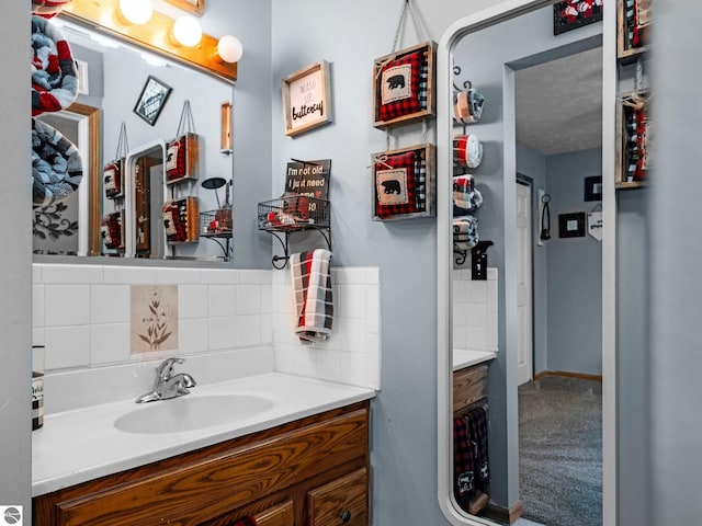 bathroom with vanity and backsplash