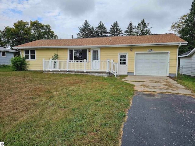 single story home with a garage, a porch, and a front yard