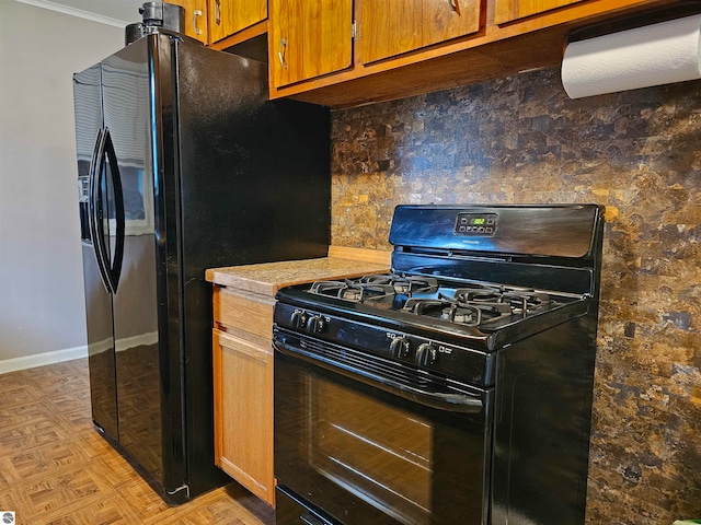 kitchen featuring black appliances and light parquet flooring