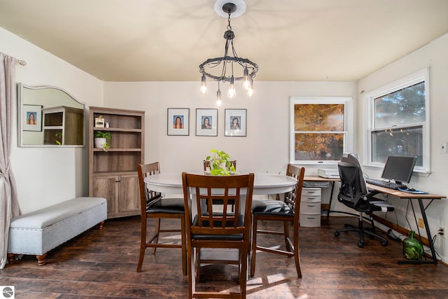 dining room featuring a notable chandelier and dark wood-type flooring