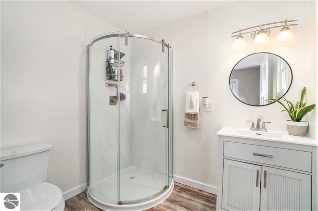 1219 Elm St, Frankfort, MI 49635 - bathroom with wood finished floors, baseboards, and a stall shower