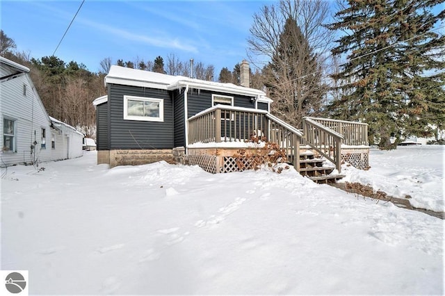 1219 Elm St, Frankfort, MI 49635 - bungalow-style house featuring a chimney and a deck