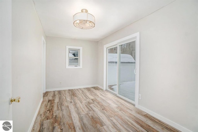 1219 Elm St, Frankfort, MI 49635 - unfurnished room featuring light wood finished floors and baseboards