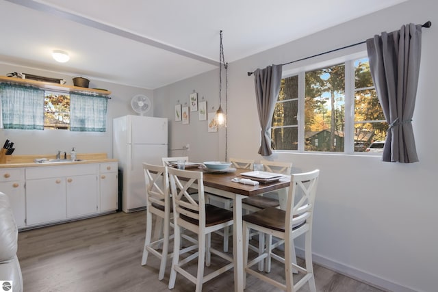 dining area with light wood-type flooring