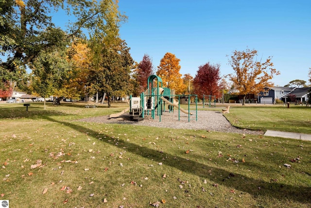 communal playground featuring a yard