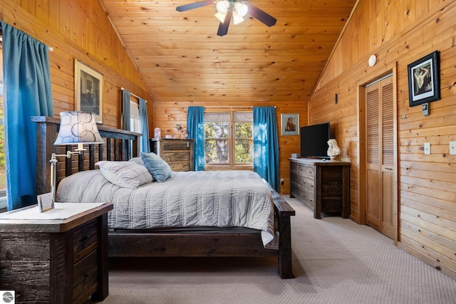 carpeted bedroom featuring wood walls, high vaulted ceiling, wooden ceiling, and ceiling fan