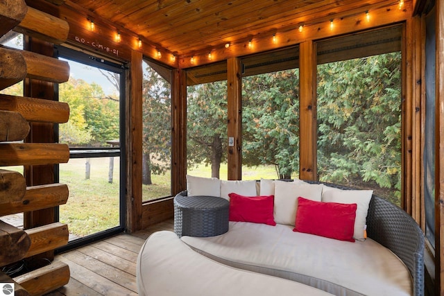 sunroom with wooden ceiling and plenty of natural light