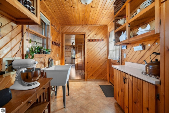 interior space featuring light parquet floors and wood walls