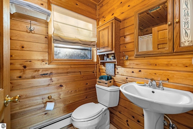 bathroom featuring toilet, wood walls, baseboard heating, and a shower with curtain