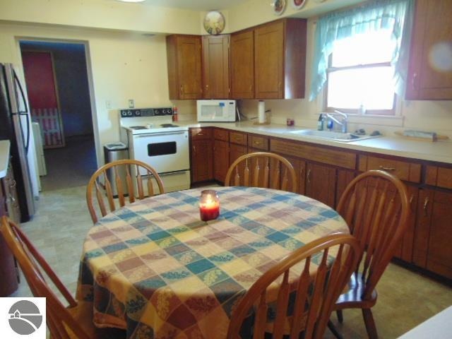 kitchen with white appliances and sink