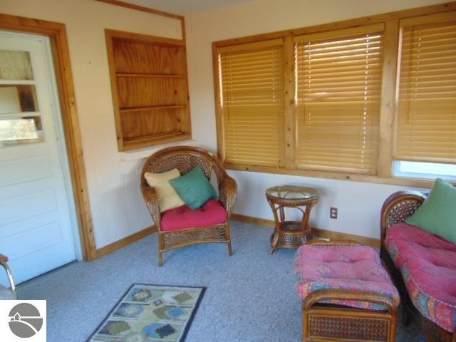 sitting room featuring carpet