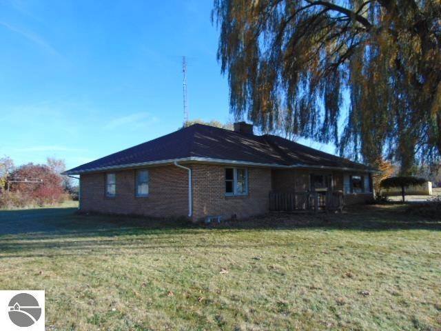 view of home's exterior with a lawn