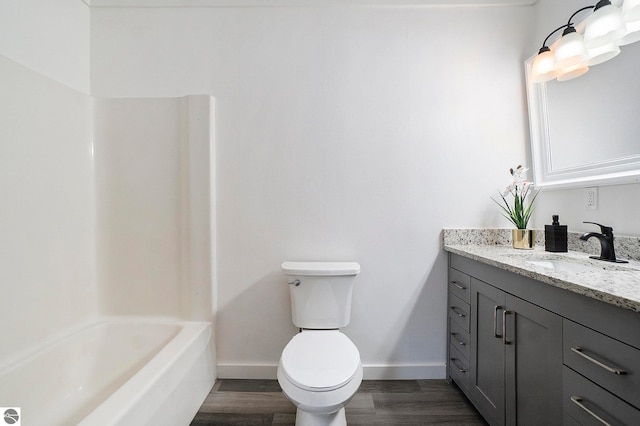 full bathroom with toilet, vanity, wood-type flooring, and shower / bathtub combination