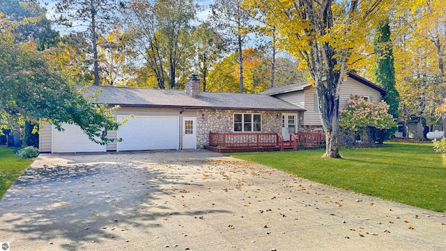 view of front of home with a front yard and a garage