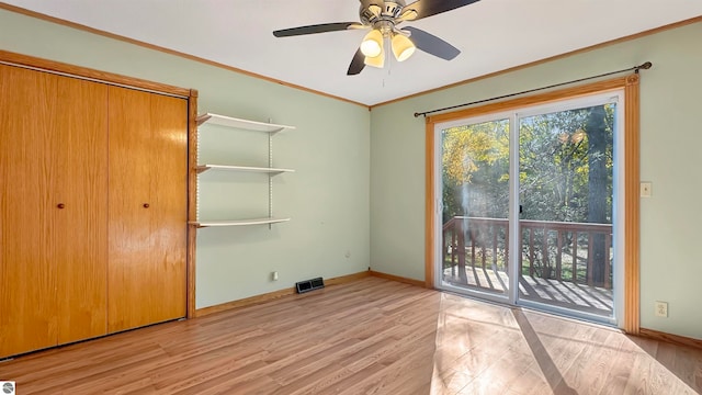 unfurnished bedroom featuring a closet, light hardwood / wood-style flooring, access to exterior, and ceiling fan